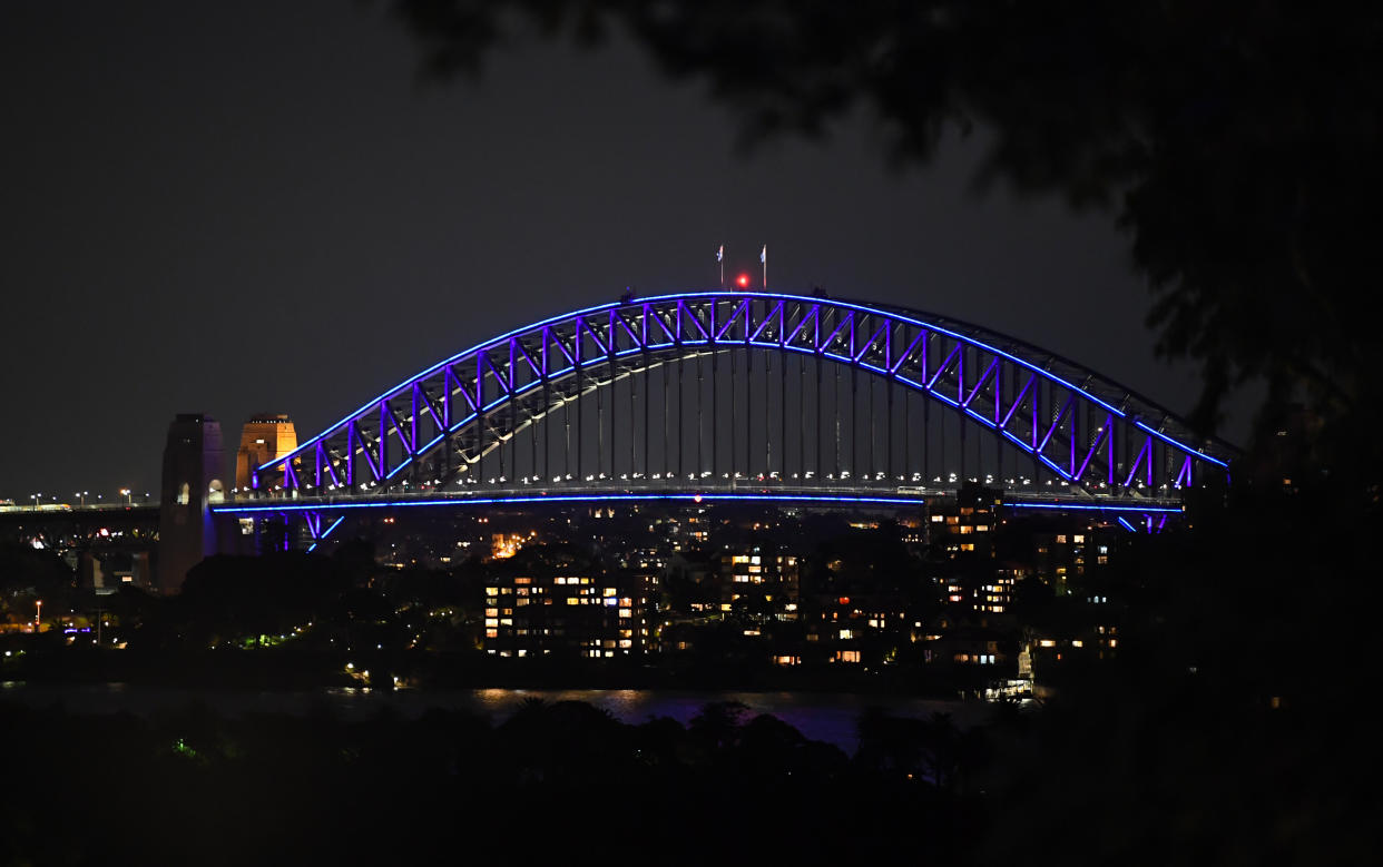 The Harbour Bridge lit blue as seen from the main trail during the media preview of Vivid Sydney at Taronga Zoo on May 19, 2019 in Sydney, Australia. An illuminated trail of almost 300 lit lanterns of endangered species will glow every night at the zoo during Vivid Sydney which runs from May 24 throughout Sydney with hundreds of lit buildings and exhibits which attract hundreds of thousands of visitors each year