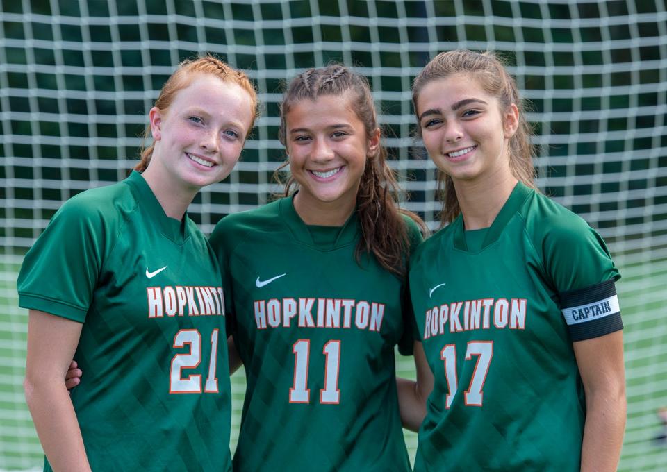 Hopkinton High School senior Georgie Clarke, junior Nina Tzouganatos, and senior Juliana Grontzos, Sept. 12, 2023.