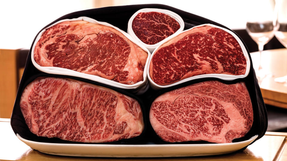 American (top three) and Japanese (bottom two) wagyu have different marbling patterns. - Credit: Photo: courtesy CUT by Wolfgang Puck