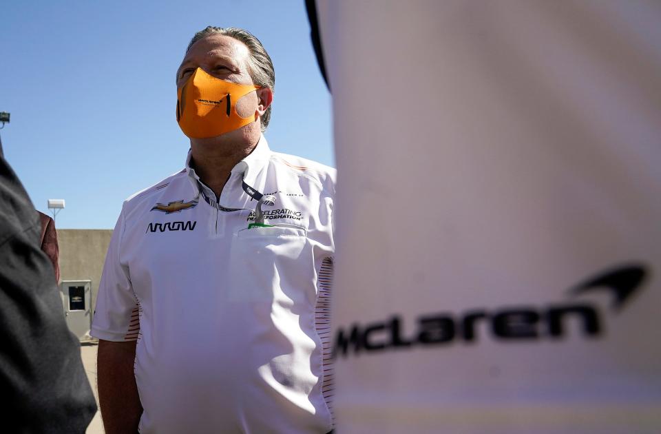 Zak Brown, Chief Executive Officer of McLaren Racing, talks with Mark Miles, President and Chief Executive Officer of Penske Entertainment Corp., Sunday, May 30, 2021, at the 105th running of the Indianapolis 500 at Indianapolis Motor Speedway.