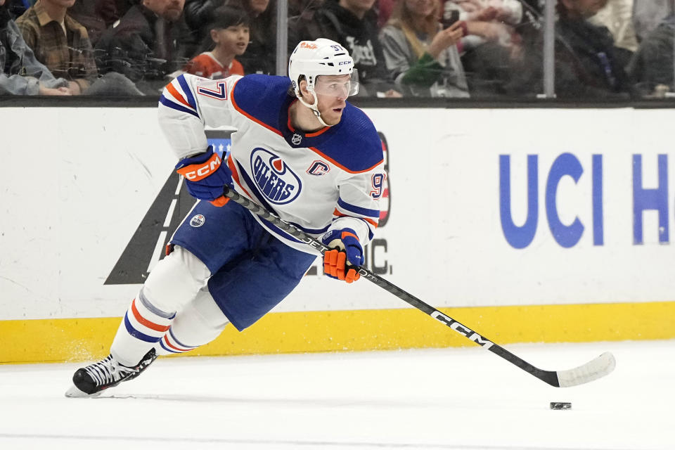 Edmonton Oilers center Connor McDavid takes the puck during the first period of an NHL hockey game against the Anaheim Ducks Sunday, Dec. 31, 2023, in Anaheim, Calif. (AP Photo/Mark J. Terrill)