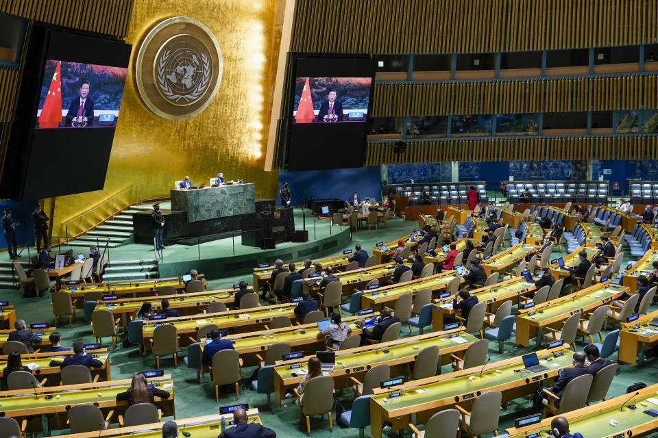 Chinese President Xi Jinping is seen on a video screen as he addresses the 76th Session of the United Nations General Assembly remotely, Tuesday, Sept. 21, 2021 at U.N. headquarters. (AP Photo/Mary Altaffer, Pool)