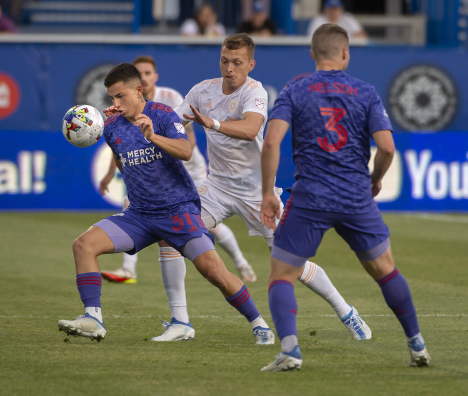 FC Cincinnati midfielder Alvaro Barreal (31) moves with the ball as CF Montreal defender Alistair Johnston, center, pursues during first-half MLS soccer match action in Montreal, Saturday, May 28, 2022. (Peter McCabe/The Canadian Press via AP)