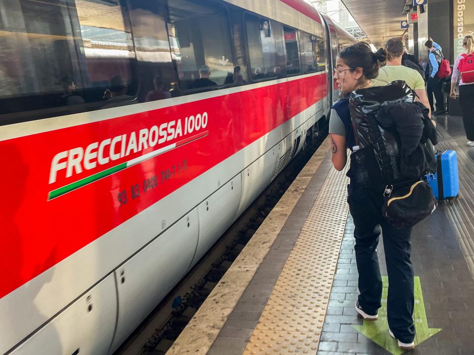 The author prepares to board a business-class car on a Frecciarossa train in Italy.