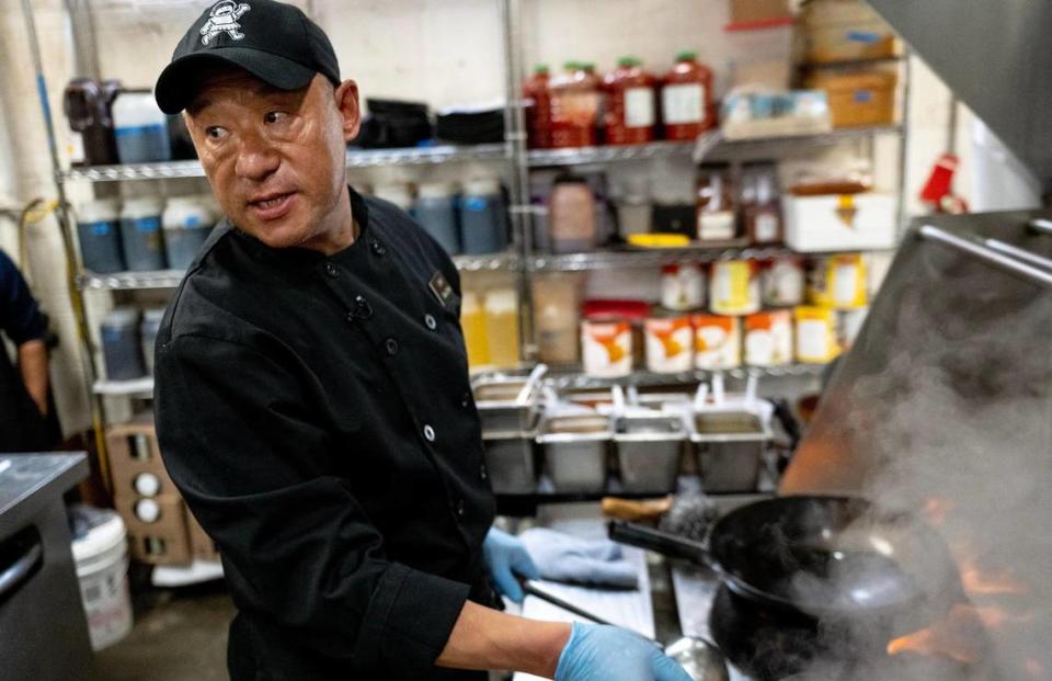 Max Chao, executive chef at Lulu’s Thai Noodle Shop, prepares an order of Kaeng Khiao Wan Kai, or green curry.