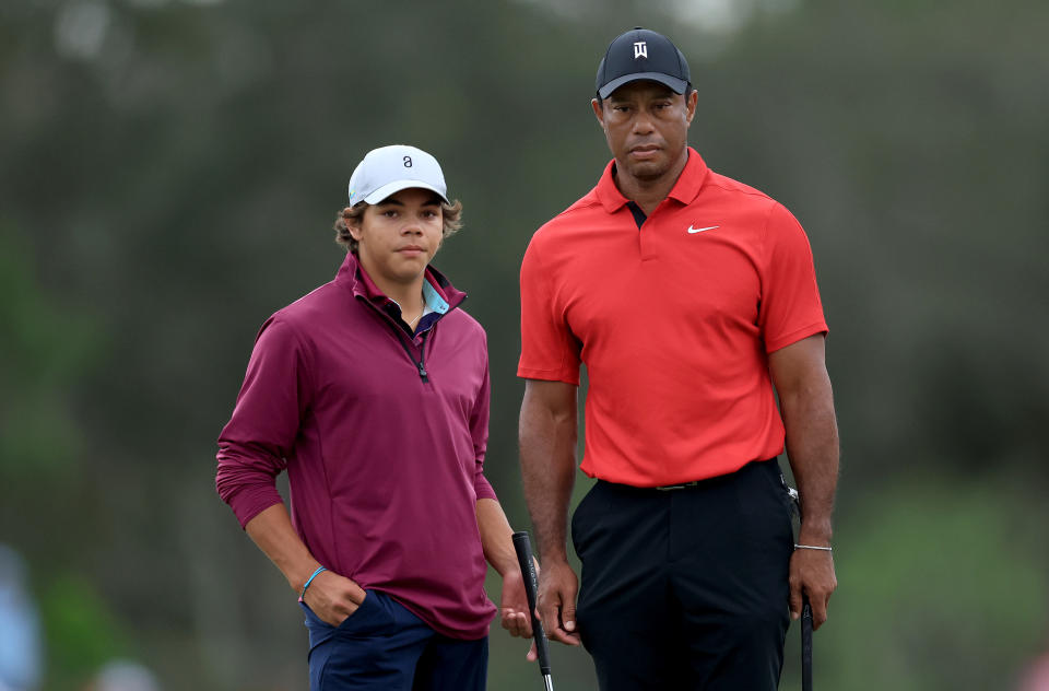 If Charlie Woods (left) qualifies for the PGA event at age 15, he'd beat his father, who made his PGA Tour debut at 16. (Photo by David Cannon/Getty Images)