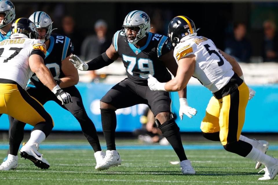 Carolina Panthers offensive tackle Brady Christensen (70) and Carolina Panthers offensive tackle Ikem Ekwonu (79) come off the line against Pittsburgh Steelers defense during a game at Bank of America Stadium in Charlotte, N.C., Sunday, Dec. 18, 2022.