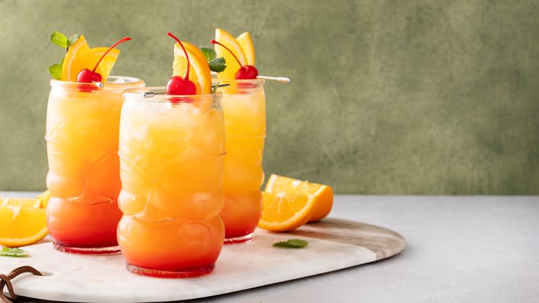 Three rum punch cocktails