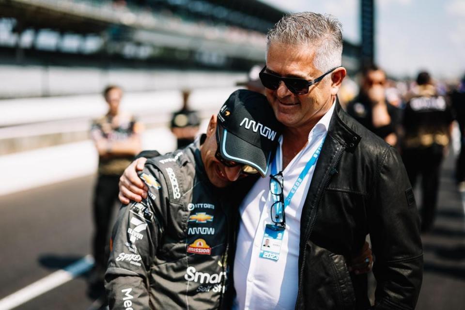 Tony Kanaan (left) hugs his longtime friend Gil de Ferran in at the Indianapolis Motor Speedway in May of 2023 in the leadup to Kanaan's final IndyCar start.