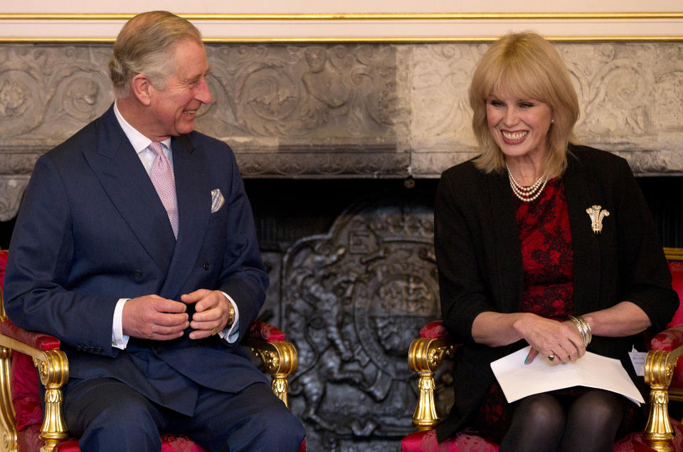 Britain's Prince Charles, the President, Arts and Business, smiles with actress Joanna Lumley during a ceremony to award The Prince of Wales Medal for Philanthropy for 2013, in London, Wednesday, Dec. 11, 2013.(AP Photo/Alastair Grant ,Pool)