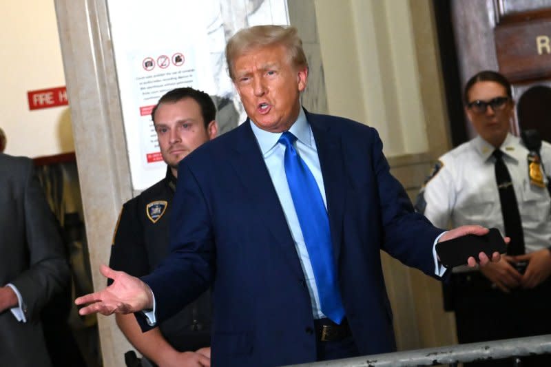 Former President Donald Trump speaks outside the courtroom, telling reporters his former attorney Michael Cohen "is not a credible witness," during the fourth week of his civil fraud trial at State Supreme Court on Tuesday in New York City. Photo by Louis Lanzano/UPI