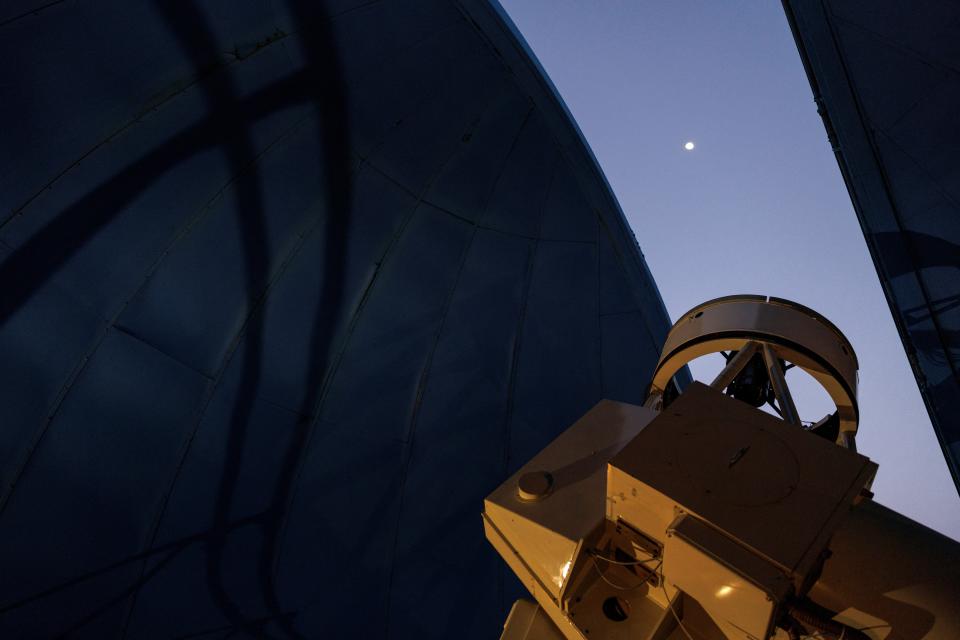 The moon is seen through the open canopy of the Kryoneri Observatory, before the telescope tracks a green comet named Comet C/2022 E3 (ZTF), in Kryoneri, Greece, February 1, 2023. (REUTERS)