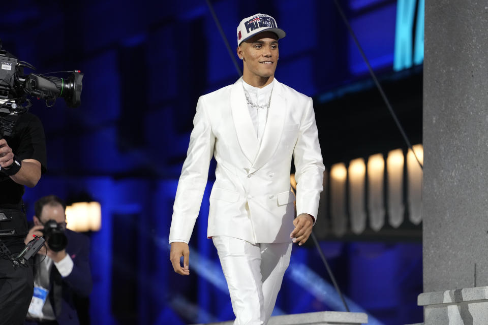 Oregon cornerback Christian Gonzalez walks onto the stage after he was chosen by the New England Patriots with the No. 17 pick at the 2023 NFL Draft, Thursday, April 27, 2023, in Kansas City, Mo. (AP Photo/Steve Luciano)