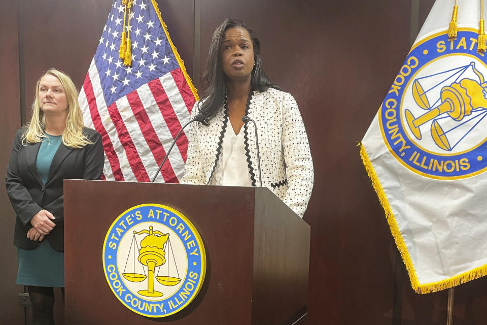 Cook County, Ill., State's Attorney Kim Foxx, center, announced Monday, Jan. 30, 2023, in Chicago that she is dropping sex abuse charges against singer R. Kelly. Kelly, born Robert Sylvester Kelly, is serving a 30-year prison sentence in the New York case and awaits sentencing on Feb. 23, in Chicago federal court. (AP Photo/Claire Savage)