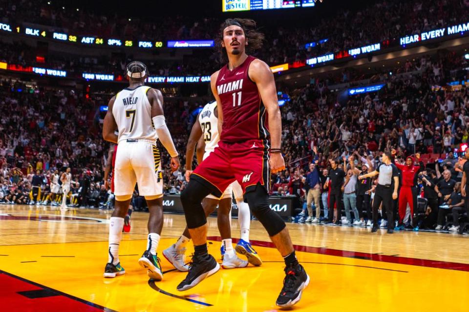 Miami Heat Jaime Jaquez Jr. (11) reacts to dunking on Indiana Pacers forward Bruce Brown (11) during the second half of an NBA game at Kaseya Center in Miami, Florida, on Thursday, November 30, 2023.