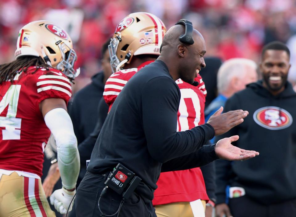 FILE - San Francisco 49ers defensive coordinator DeMeco Ryans celebrate on the sideline during the team's NFL football game against the Washington Commanders, Dec. 24, 2022, in Santa Clara, Calif. Detroit Lions offensive coordinator Ben Johnson, Ryans and Philadelphia Eagles offensive coordinator Shane Steichen are the finalists for AP Assistant Coach of the Year.(AP Photo/Scot Tucker, File)