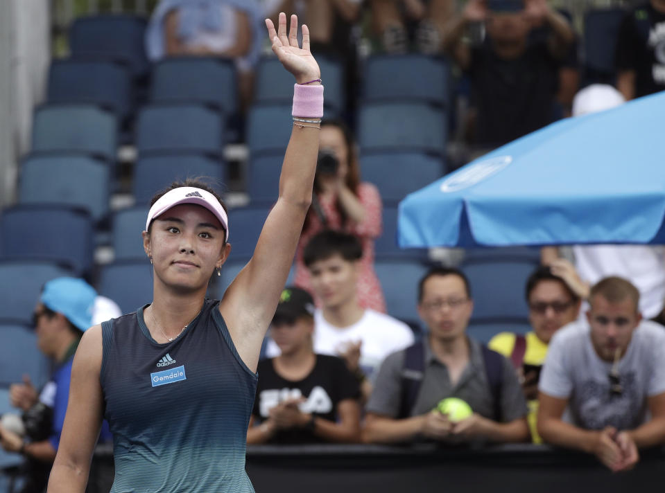 China's Wang Qiang waves after defeating Serbia's Aleksandra Krunic in their second round match at the Australian Open tennis championships in Melbourne, Australia, Thursday, Jan. 17, 2019. (AP Photo/Kin Cheung)