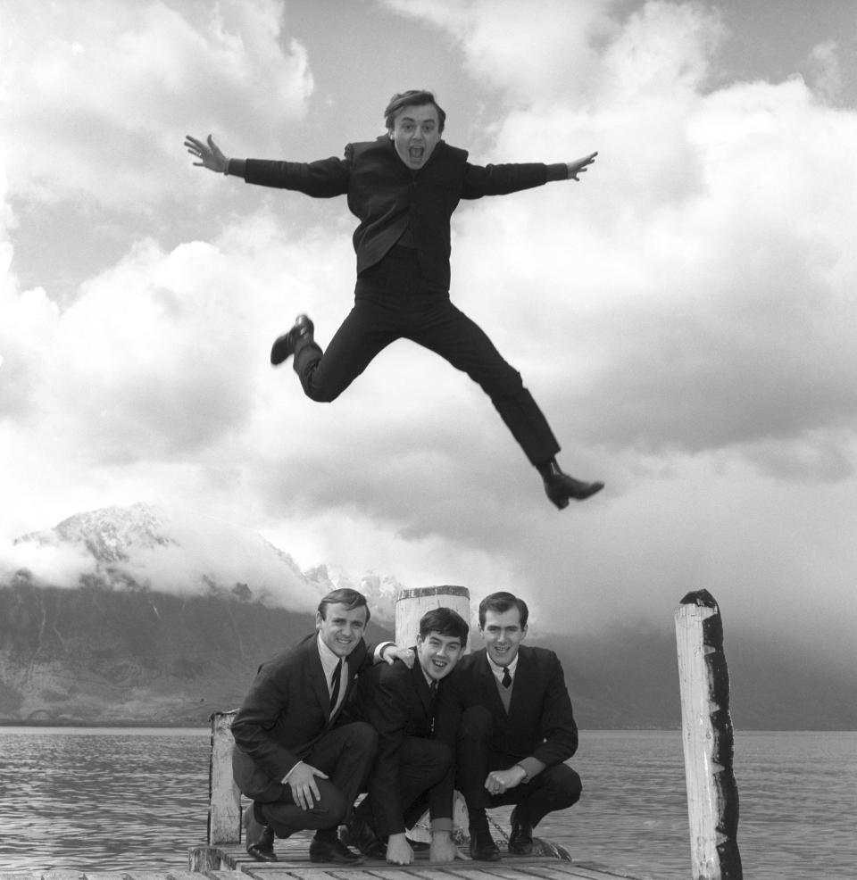 FILE - In this April 25, 1964 file photo, Gerry Marsden leaps over his band, the Pacemakers. Gerry Marsden, the British singer and lead singer of Gerry and the Pacemakers, who was instrumental in turning a song from the Rodgers and Hammerstein musical “Carousel” into one of the great anthems in the world of football, has died. He was 78. (PA via AP, File)