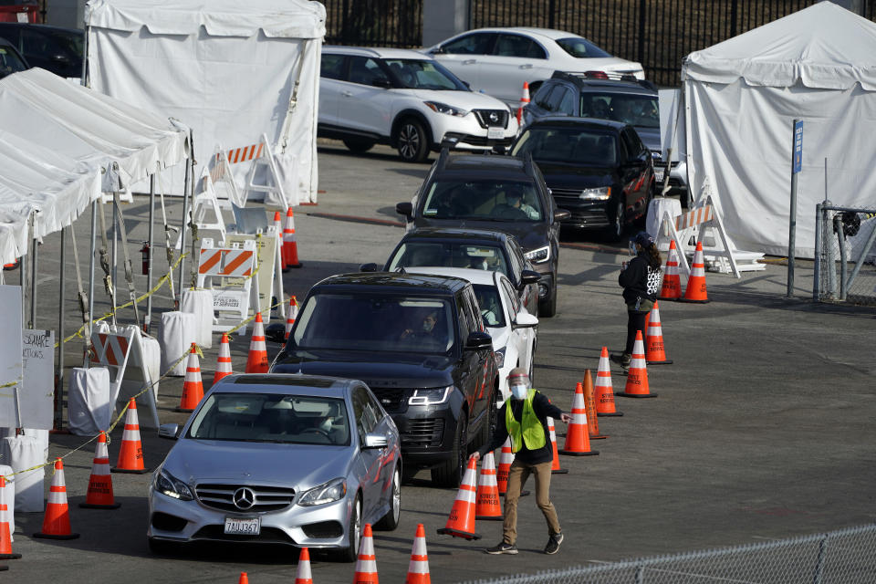 Motorists line up to take a COVID-19 test Tuesday, Jan. 5, 2021, in Los Angeles. (AP Photo/Marcio Jose Sanchez)