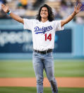 <p><em>Ted Lasso</em> star Cristo Fernández throws the first pitch at the Dodgers vs. Pirates game on Aug. 17 in L.A.</p>