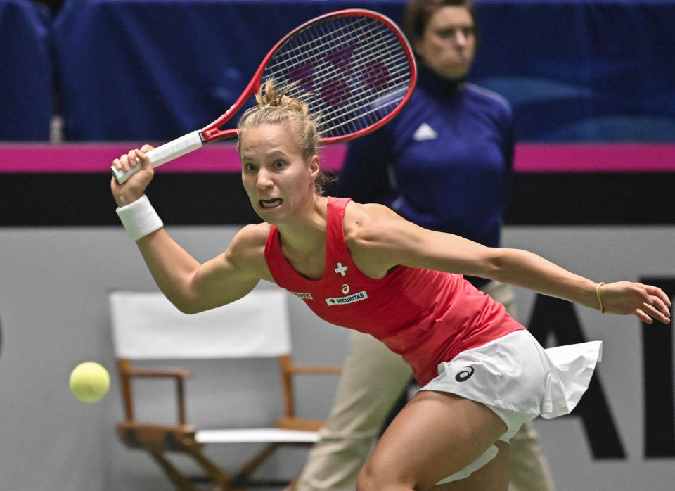 Switzerland's Viktorija Golubic returns to United States' Sloane Stephens during their playoff-round Fed Cup tennis match, Sunday, April 21, 2019, in San Antonio. (AP Photo/Darren Abate)