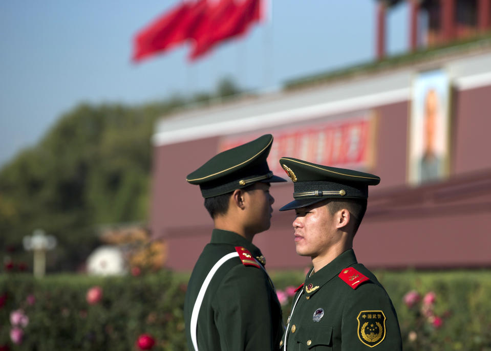 Chinese paramilitary policemen stand guard near Tiananmen Gate in Beijing Thursday, Nov. 1, 2012. Beijing is tightening security as its all-important Communist Party congress approaches, and some of the measures seem bizarre. Most of the security measures were implemented in time for Thursday's opening of a meeting of the Central Committee. (AP Photo/Andy Wong)