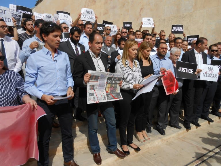 Reporters held a minute's silence midweek in respect for slain blogger Caruana Galizia outside parliament