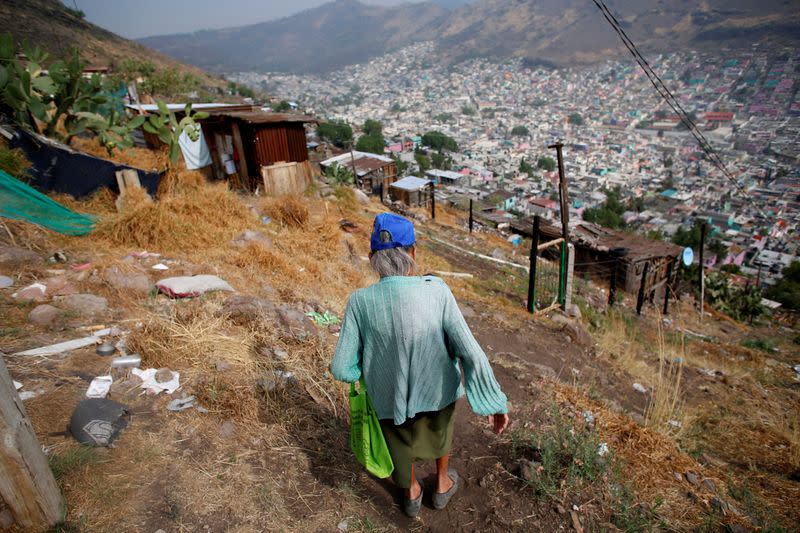 Cuenca walks toward her house in the Tablas del Pozo neighborhood of Ecatepec amid the spread of the coronavirus disease (COVID-19) in the state of Mexico