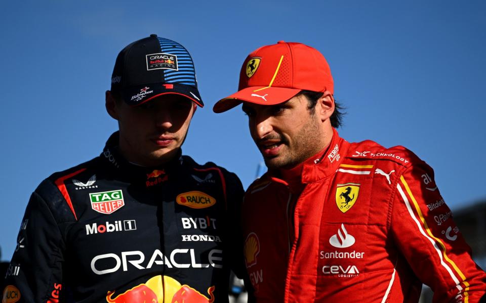 Pole position qualifier Max Verstappen of the Netherlands and Oracle Red Bull Racing and Second placed qualifier Carlos Sainz of Spain and Ferrari talk in parc ferme during qualifying ahead of the F1 Grand Prix of Australia at Albert Park Circuit on March 23, 2024 in Melbourne, Australia