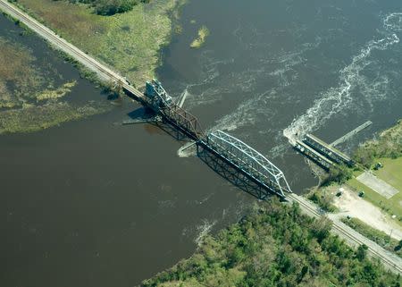 Flooding is seen in and around Wilmington, North Carolina, U.S., September 19, 2018 in this picture obtained from social media on September 21, 2018. ALAN CRADICK, CAPE FEAR RIVER WATCH/via REUTERS