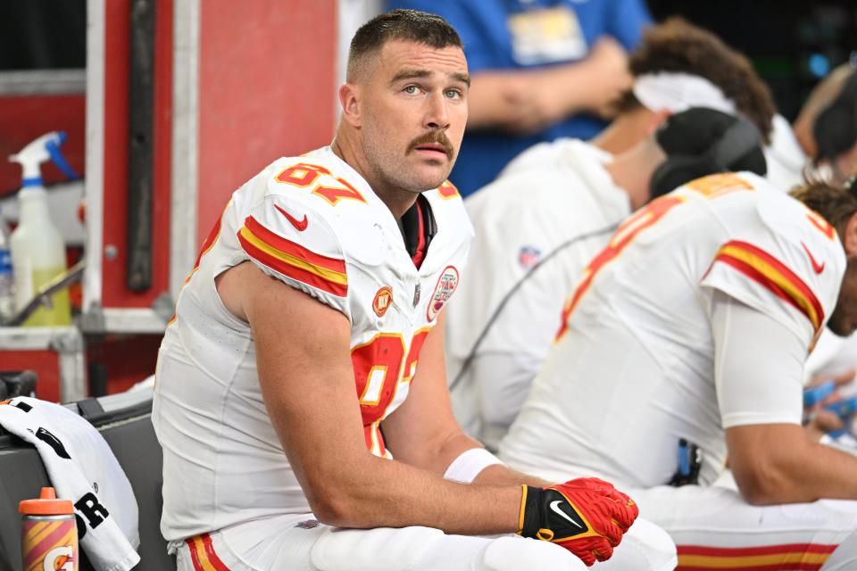 Kansas City Chiefs tight end Travis Kelce (87) looks on from the bench during the Kansas City Chiefs' game against the Minnesota Vikings, which was attended by pop star Taylor Swift.