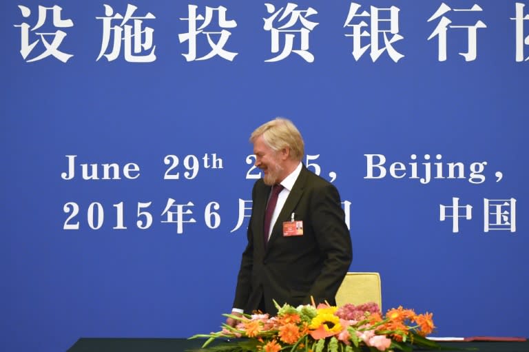Russia's Deputy Finance Minister Sergei Storchak leaves after signing an article of association to help set up the AIIB during a ceremony at the Great Hall of the People in Beijing on June 29, 2015