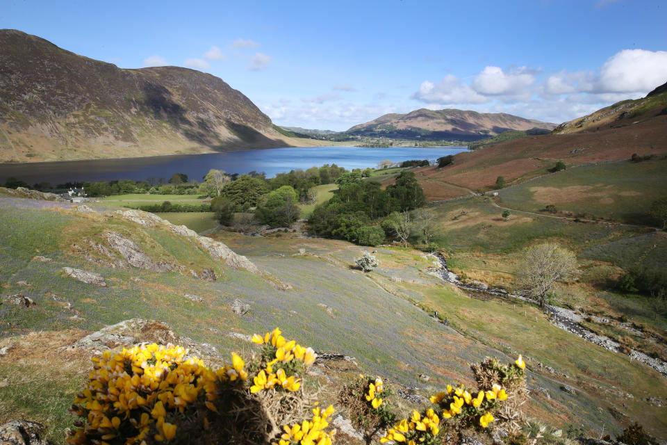 Walkers take a stroll at Rannerdale Knotts in the Lake District, Cumbria, on the first day of lifting of coronavirus lockdown restrictions on leisure activities and outdoor exercise. (Photo by Owen Humphreys/PA Images via Getty Images)