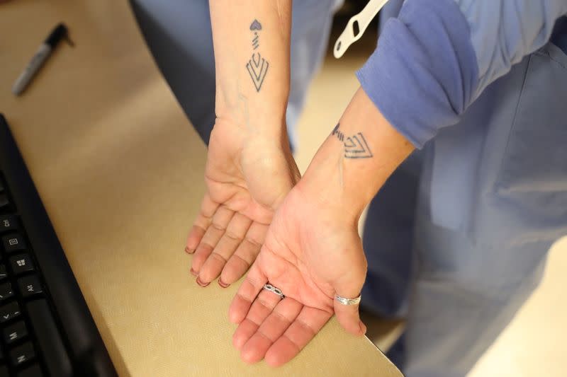 Coronavirus disease (COVID-19) ICU nurses display tattoos they all got to commemorate their bond as frontline workers and the people they have lost, at Providence Mission Hospital in Mission Viejo