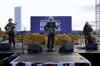 Musician Jon Bon Jovi performs at a campaign event for Democratic presidential candidate former Vice President Joe Biden at Dallas High School in Dallas, Pa., Saturday, Oct. 24, 2020. (AP Photo/Andrew Harnik)