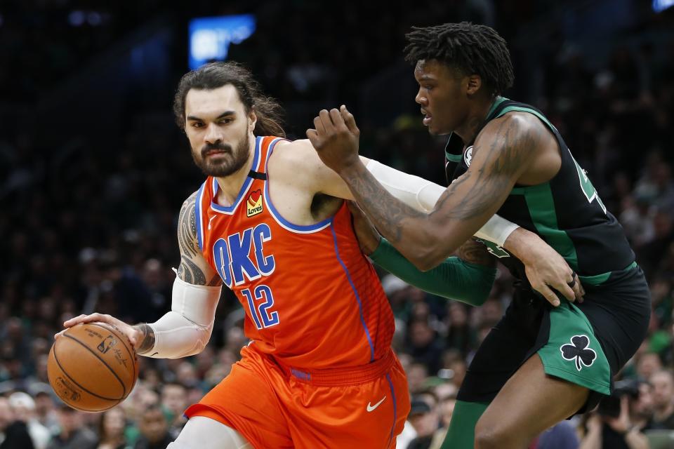 Oklahoma City Thunder's Steven Adams (12) drives past Boston Celtics' Robert Williams III during the second half of an NBA basketball game, Sunday, March, 8, 2020, in Boston. (AP Photo/Michael Dwyer)