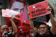 Demonstrators march during a protest to demand authorities scrap a proposed extradition bill with China, in Hong Kong, China April 28, 2019. REUTERS/Tyrone Siu