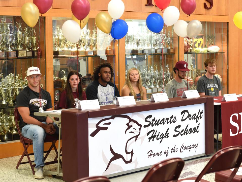 Six Stuarts Draft senior athletes celebrated their college commitments Friday during a ceremony at the high school. From left, Aaron Nice (Bridgewater College, football/track), Allison Quick (Bridgewater College, soccer), Jayson Williams (Shepherd University, football), Leah Wood (Liberty University, track), Dawson Jones (Southern Virginia University, baseball) and Chase Schages (Randolph College, basketball).