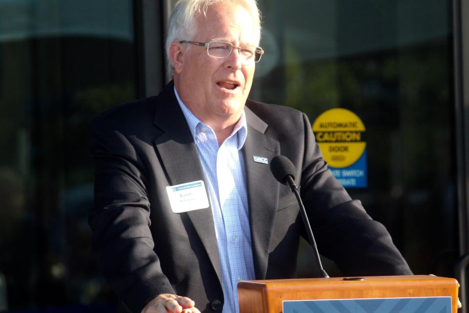 GRCC alum and current West Ottawa and OAISD board member Randy Schipper speaks during an event celebrating the opening of the GRCC Lakeshore Campus in Holland Township.