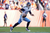 Tennessee Titans quarterback Ryan Tannehill scrambles during the second half of an NFL football game against the Denver Broncos, Sunday, Oct. 13, 2019, in Denver. (AP Photo/Jack Dempsey)