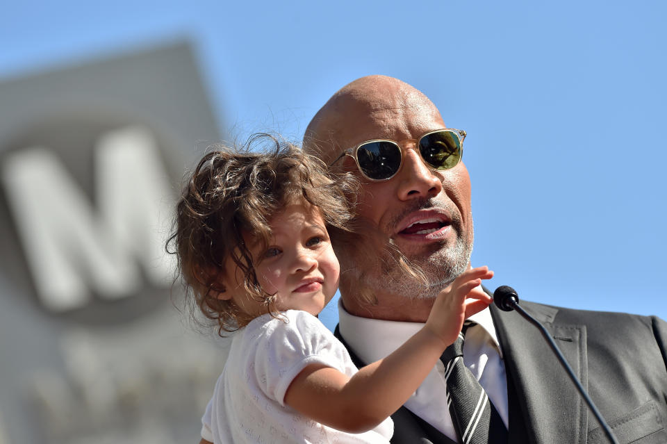 Dwayne Johnson said he, his two young daughters and his wife all caught COVID-19. (Photo by Axelle/Bauer-Griffin/FilmMagic)