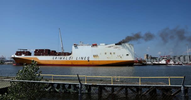 PHOTO: A fire burns on a cargo ship, where two New Jersey firefighters were killed after they became trapped while battling a blaze, at Port Newark, N.J., July 6, 2023. (Mike Segar/Reuters)