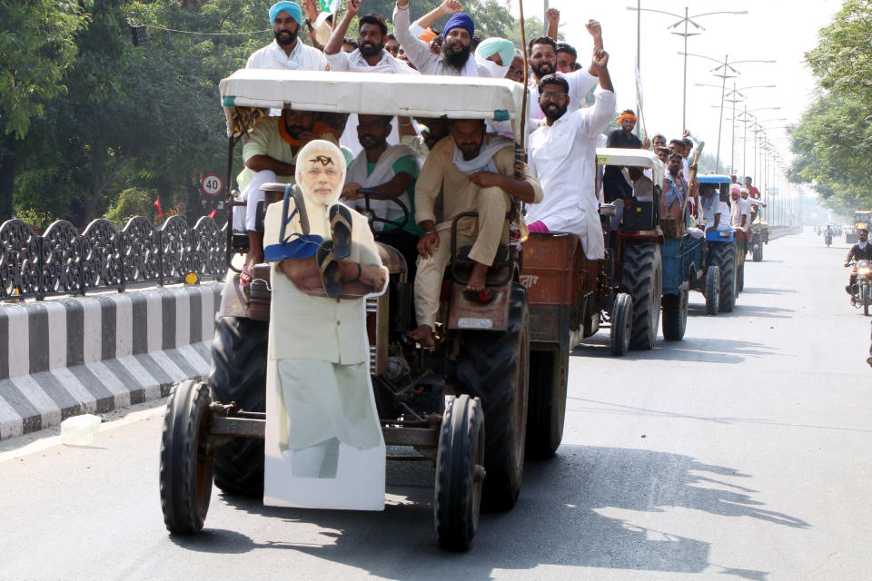 Bharti Kisan Union Ekta Ugraha members take out a protest march against the agricultural reform bills passed in the parliament, at Kanhaiya Chowk, on September 25, 2020 in Bathinda, India. The two bills - the Farmers (Empowerment and Protection) Agreement on Price Assurance and Farm Services Bill, 2020 and the Farming Produce Trade and Commerce (Promotion and Facilitation) Bill, 2020 - were passed by the Rajya Sabha despite uproar and strong protest by the Opposition parties in the house. (Photo by Sanjeev Kumar/Hindustan Times via Getty Images)