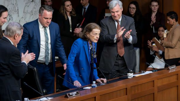 PHOTO: Sen. Dianne Feinstein is welcomed back to the Senate Judiciary Committee with applause from Senate Judiciary Committee Chairman Dick Durbin, left, and Sen. Sheldon Whitehouse, right, following a more than two-month absence, May 11, 2023. (J. Scott Applewhite/AP)