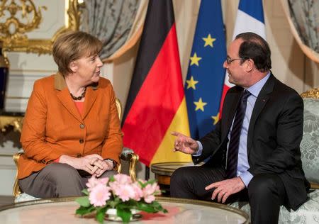 French President Francois Hollande (R) and German Chancellor Angela Merkel meet at the Prefecture in Strasbourg, France, February 7, 2016. REUTERS/Patrick Seeger/Pool