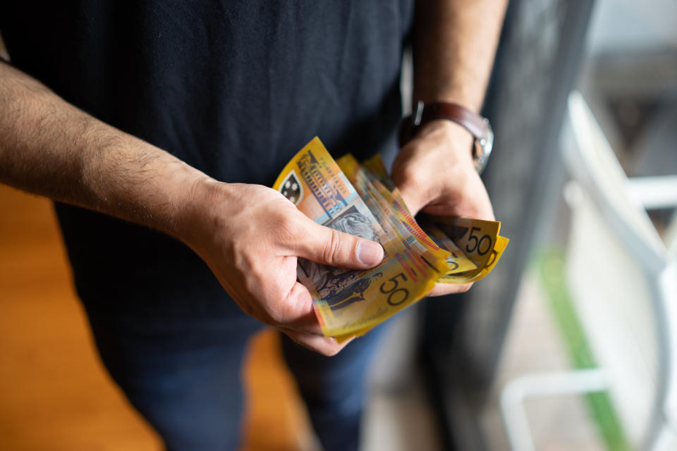 A new study shows Aussies saved, and didn't spend, their tax refunds. (Source: Getty)