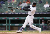 Detroit Tigers' Nomar Mazara hits a triple against the Minnesota Twins in the fourth inning of a baseball game in Detroit, Saturday, May 8, 2021. (AP Photo/Paul Sancya)