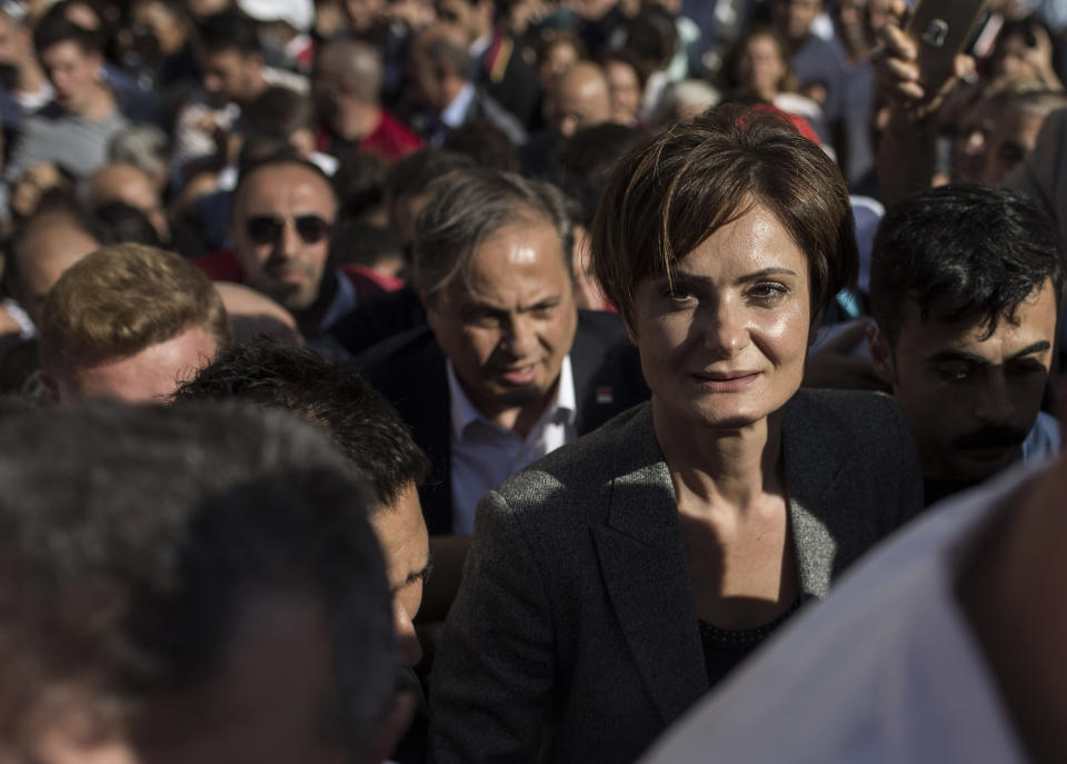 Canan Kaftancioglu, the head of Turkey's secular Republican People's Party in Istanbul, leaves the courthouse after her trial in Istanbul, Friday, Sept. 6, 2019. Turkey's state-run news agency says a court has sentenced the leader of the Istanbul branch of Turkey's main opposition party to nearly 10 years in prison over a series of tweets.(AP Photo)