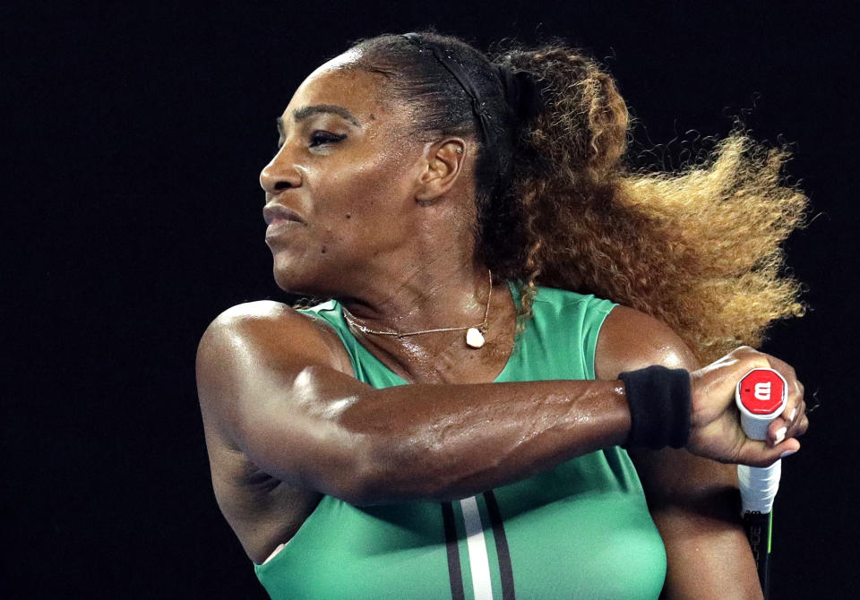 United States' Serena Williams hits a forehand return to Canada's Eugenie Bouchard during their second round match at the Australian Open tennis championships in Melbourne, Australia, Thursday, Jan. 17, 2019. (AP Photo/Aaron Favila)