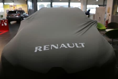 A Renault automobile is seen with a protective cover at a dealership in Saint-Herblain near Nantes, January 19, 2016. REUTERS/Stephane Mahe